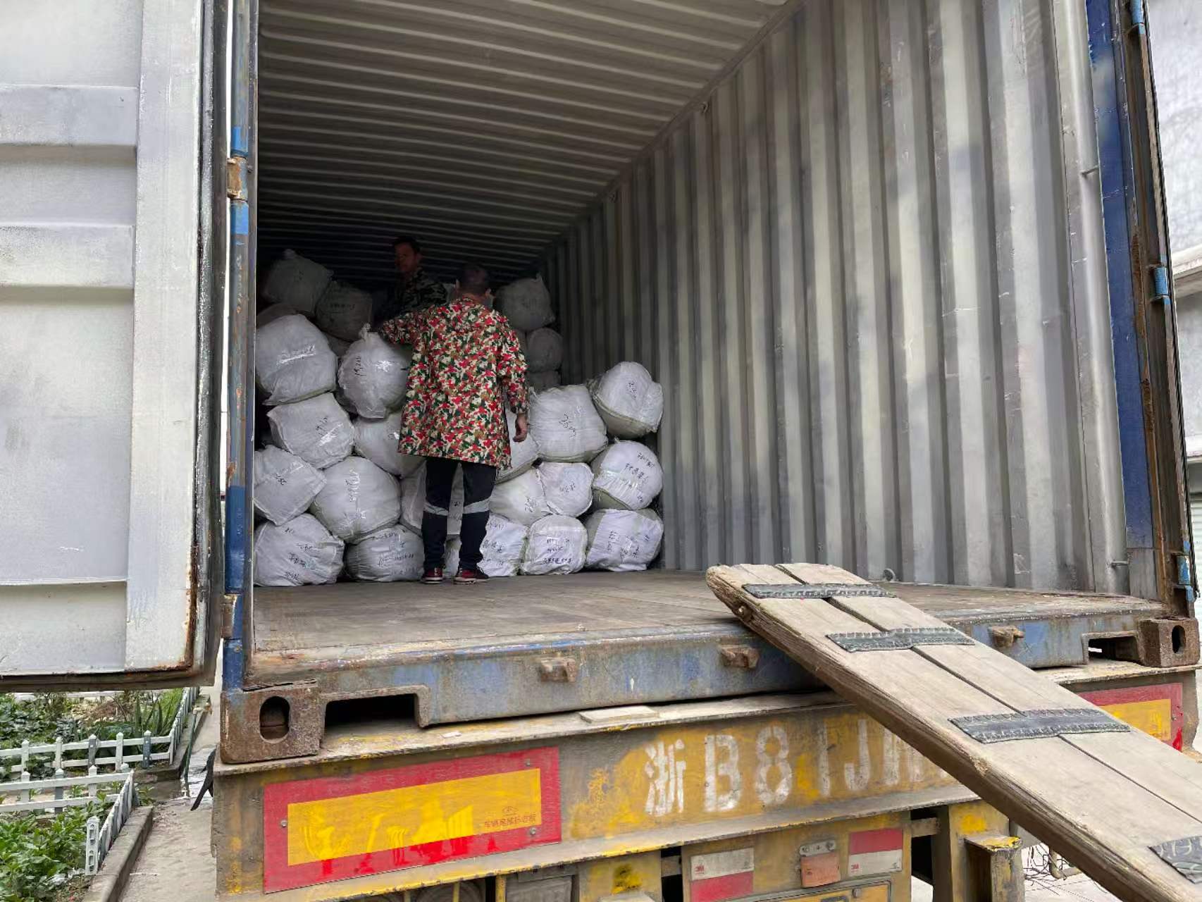 Stock fabric bales being loaded into an export container
